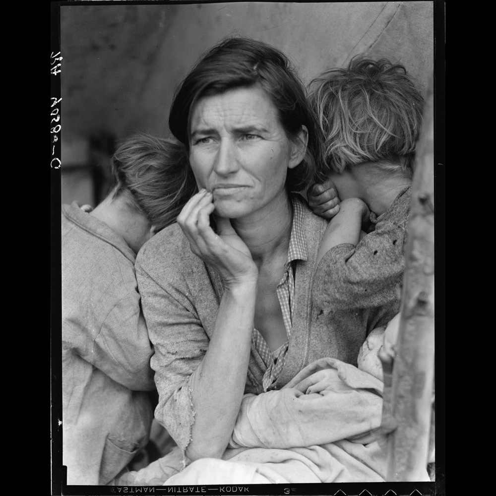 Black and white photograph of Florence Thompson, a destitute pea picker, with three of her children, 1936. This image is commonly known as “Migrant Mother.”]