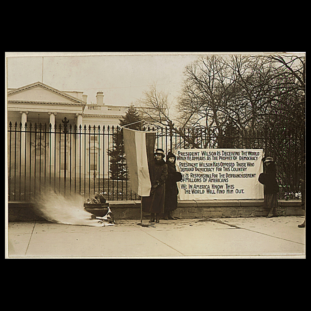 Black and white photograph of women suffragists protesting outside the White House, 1916-1918